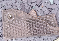 Smashed manhole cover